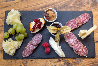 High angle view of fruits on cutting board