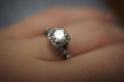 Close-up of human hand wearing diamond ring