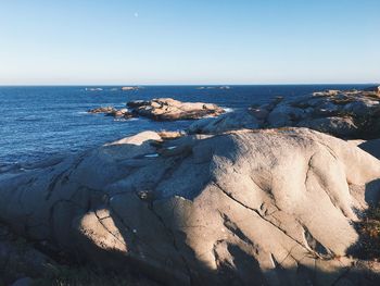 Scenic view of sea against clear blue sky