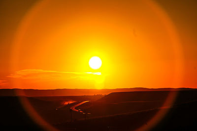 Scenic view of landscape at sunset