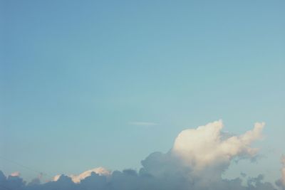 Low angle view of mountain against blue sky