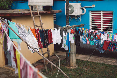 Clothes drying on clothesline against building