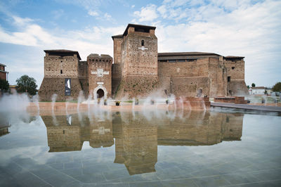 Rimini's the castel sismondo is reflected in the water emilia-romagna italy