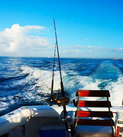 Sailboat in sea against blue sky