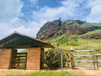 Built structure on landscape against sky