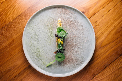 High angle view of vegetables in plate on table