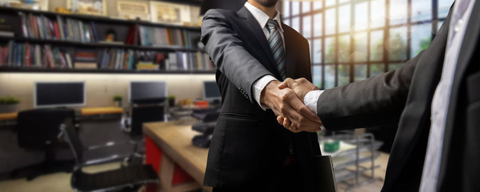 Business colleagues shaking hands