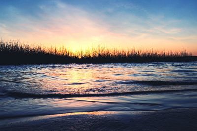 Scenic view of sea at sunset