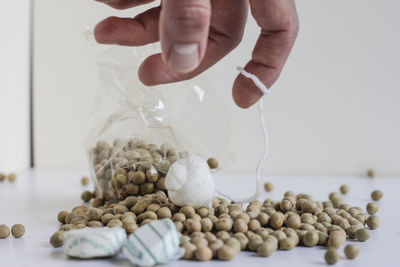 Close-up of person hand pouring