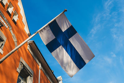 Low angle view of flag against sky