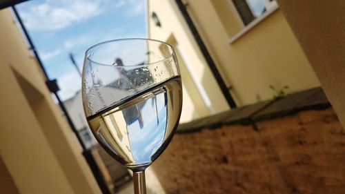 Close-up of wine glasses on table