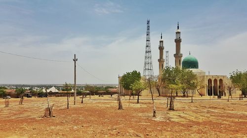 View of mosque against cloudy sky