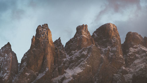 Low angle view of rocks against sky