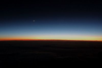 Scenic view of landscape against sky at night