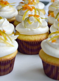 Cupcakes with icing and decorated with fruit glace