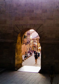 People walking in historic building