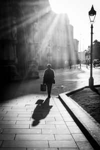 Rear view of man walking on street
