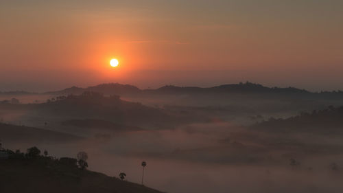 Scenic view of landscape against sky during sunset