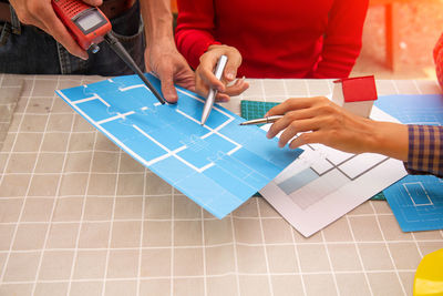 High angle view of people working at table