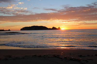 Scenic view of sea against sky during sunset