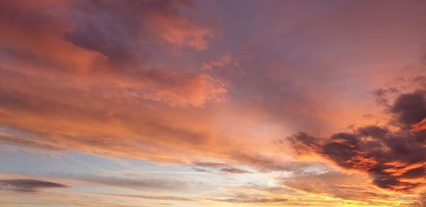 Low angle view of dramatic sky during sunset