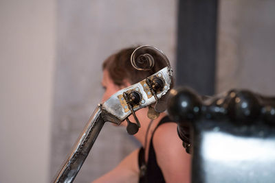 Portrait of young woman playing guitar