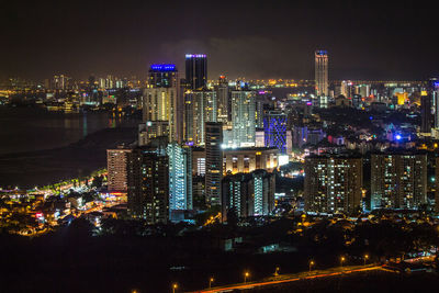 Illuminated buildings in city at night