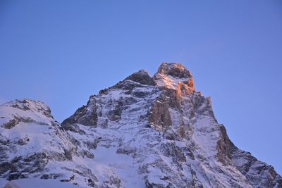 Scenic view of mountains against blue sky