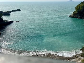 Scenic view of sea and beach against sky