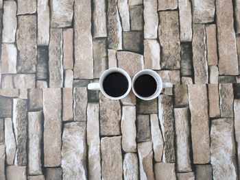 Directly above shot of coffee cup against wall