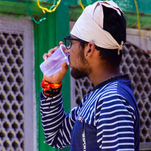 Midsection of man holding ice cream