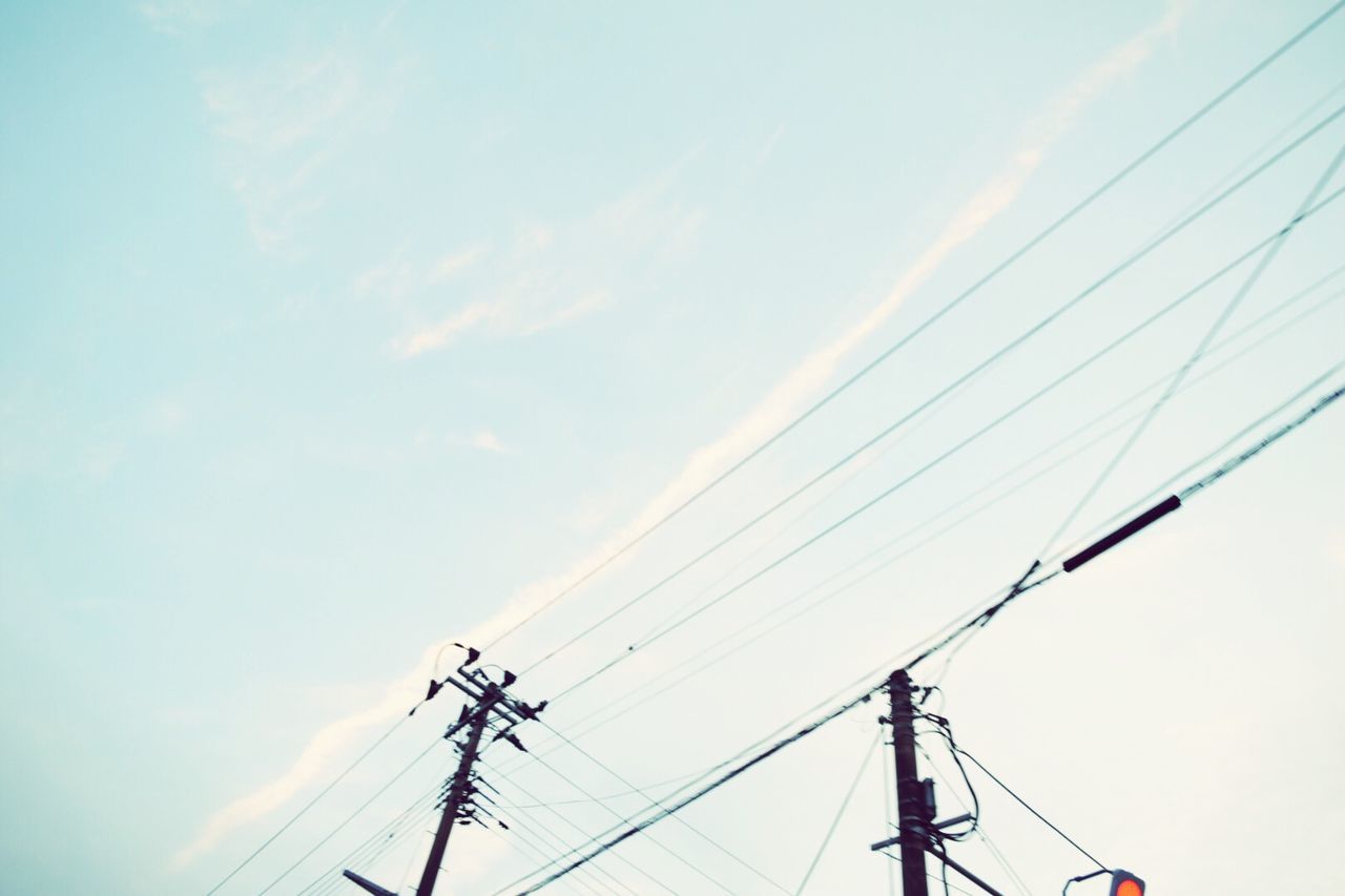 low angle view, power line, sky, electricity pylon, connection, power supply, electricity, cable, technology, fuel and power generation, cloud - sky, outdoors, day, no people, silhouette, cloud, transportation, power cable, blue, nature