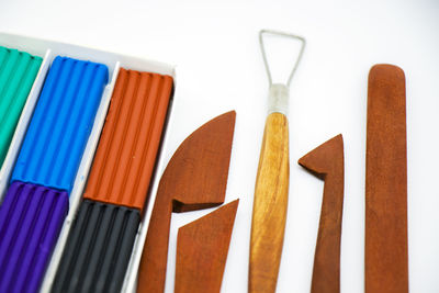 Close-up of multi colored pencils against white background