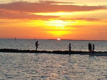 Scenic view of sea at sunset