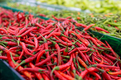 Close-up of red chili peppers for sale at market stall