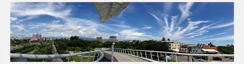 View of cityscape against blue sky