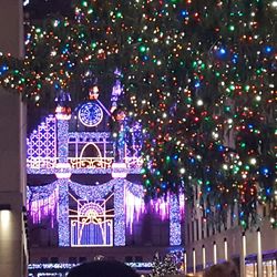 Illuminated christmas tree against sky at night