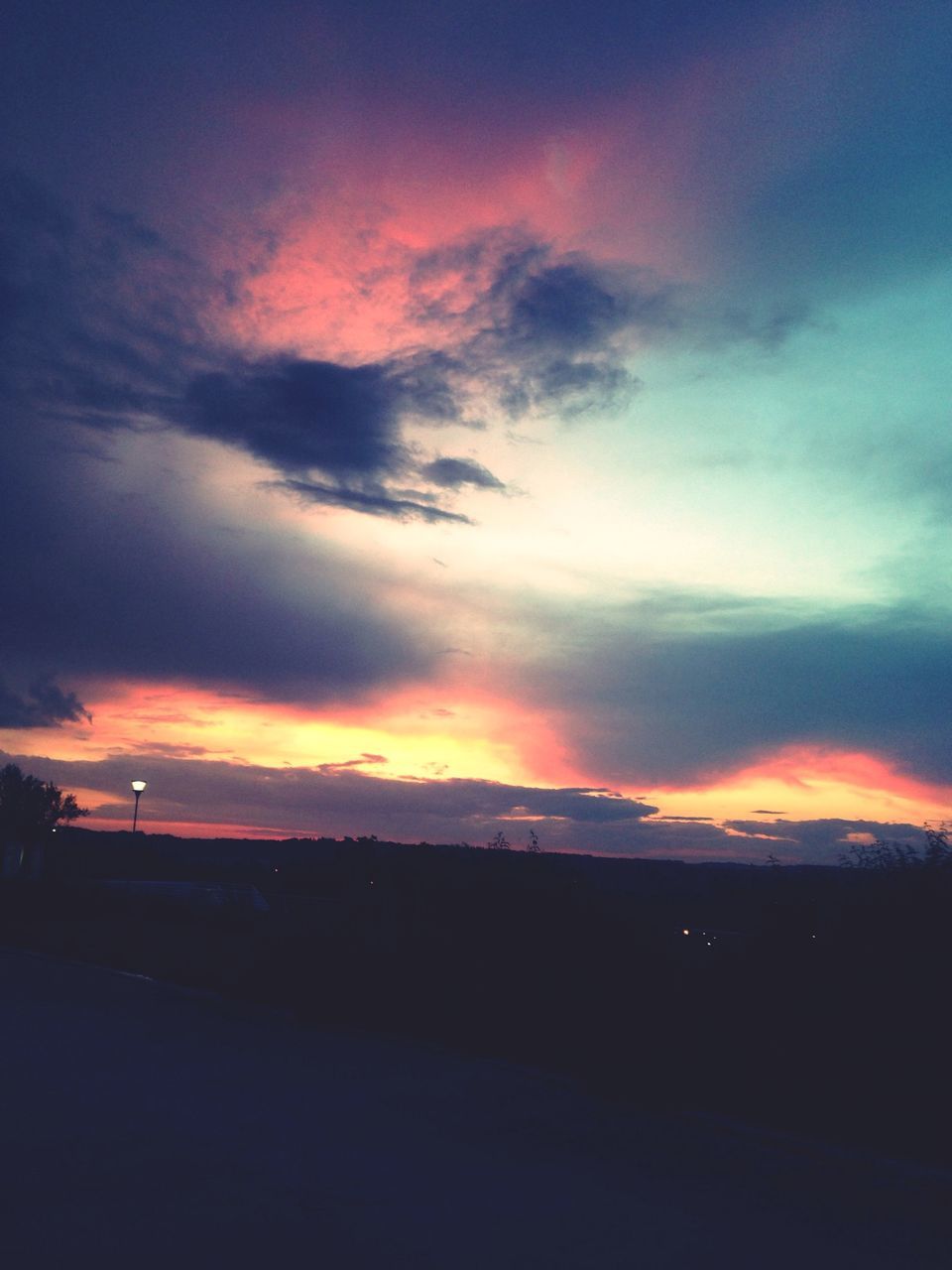 sunset, sky, silhouette, orange color, cloud - sky, scenics, beauty in nature, tranquil scene, tranquility, landscape, dramatic sky, nature, cloud, idyllic, dusk, dark, outdoors, cloudy, moody sky, no people