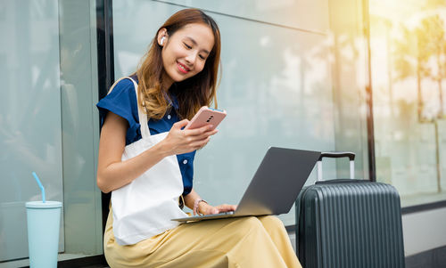 Young woman using digital tablet