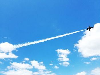 Low angle view of airplane flying in sky