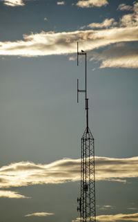 Low angle view of electricity pylon against sky