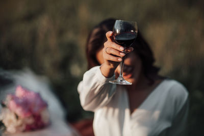 Midsection of woman holding ice cream