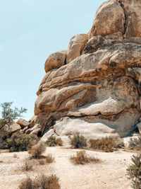 Low angle view of rock formation against sky