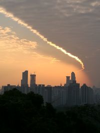 Cityscape against sky during sunset