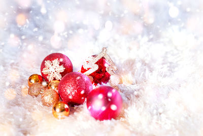 Close-up of christmas ornaments on fur