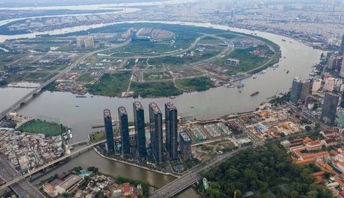 High angle view of river amidst buildings in city