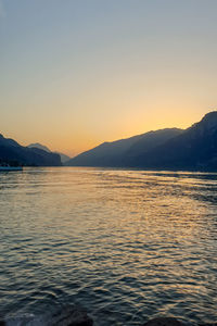 Scenic view of sea against clear sky during sunset