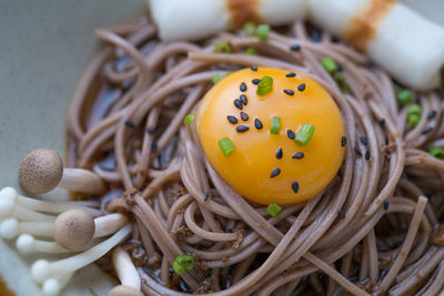 Close-up of egg yolk on noodles