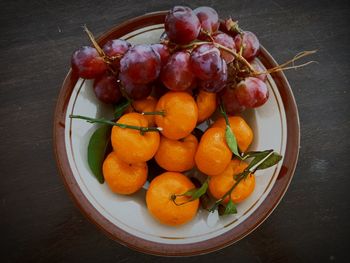 High angle view of fruits in plate on table