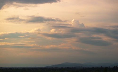 Scenic view of silhouette landscape against sky during sunset